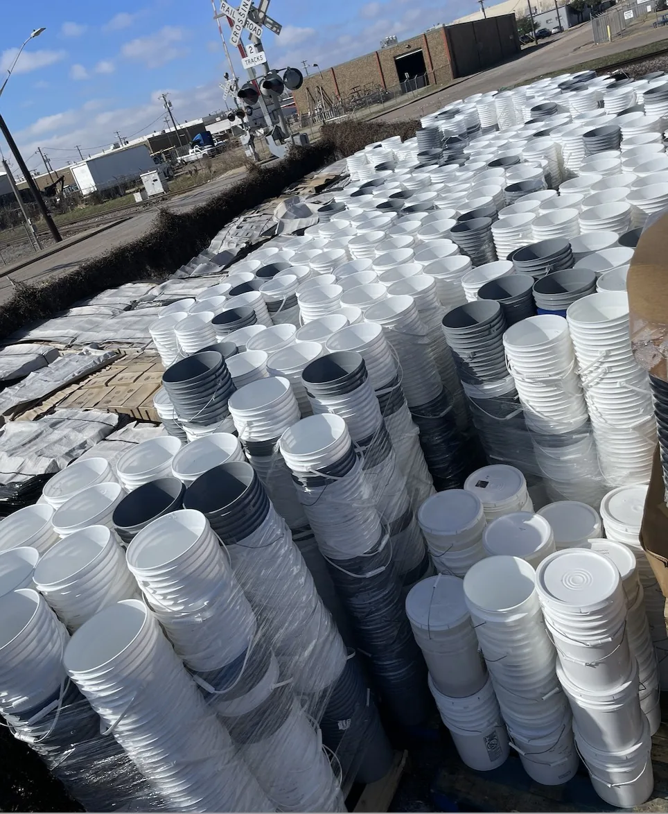 4 gallon square buckets truckload bulk stacks in the yard