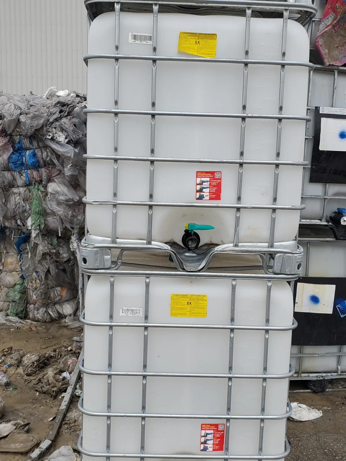Bulk stack of used IBC totes ready for truckload shipment